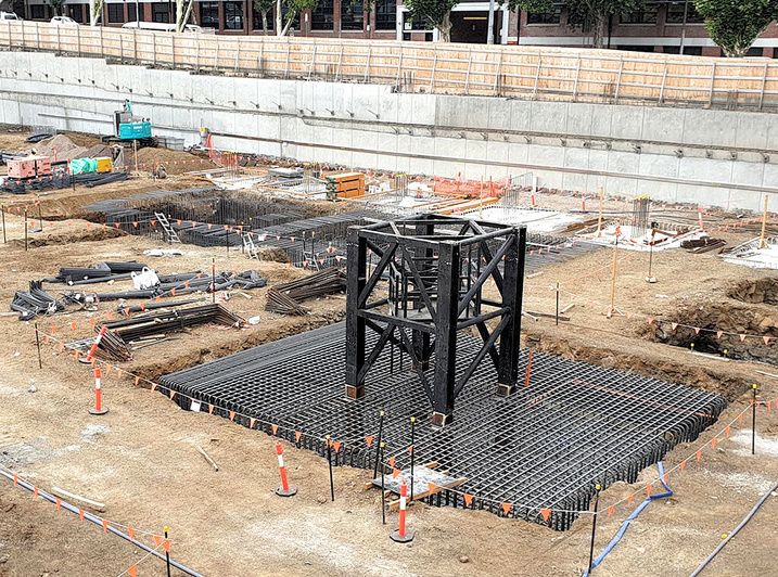Reinforcement mat and steel cage for a core footing