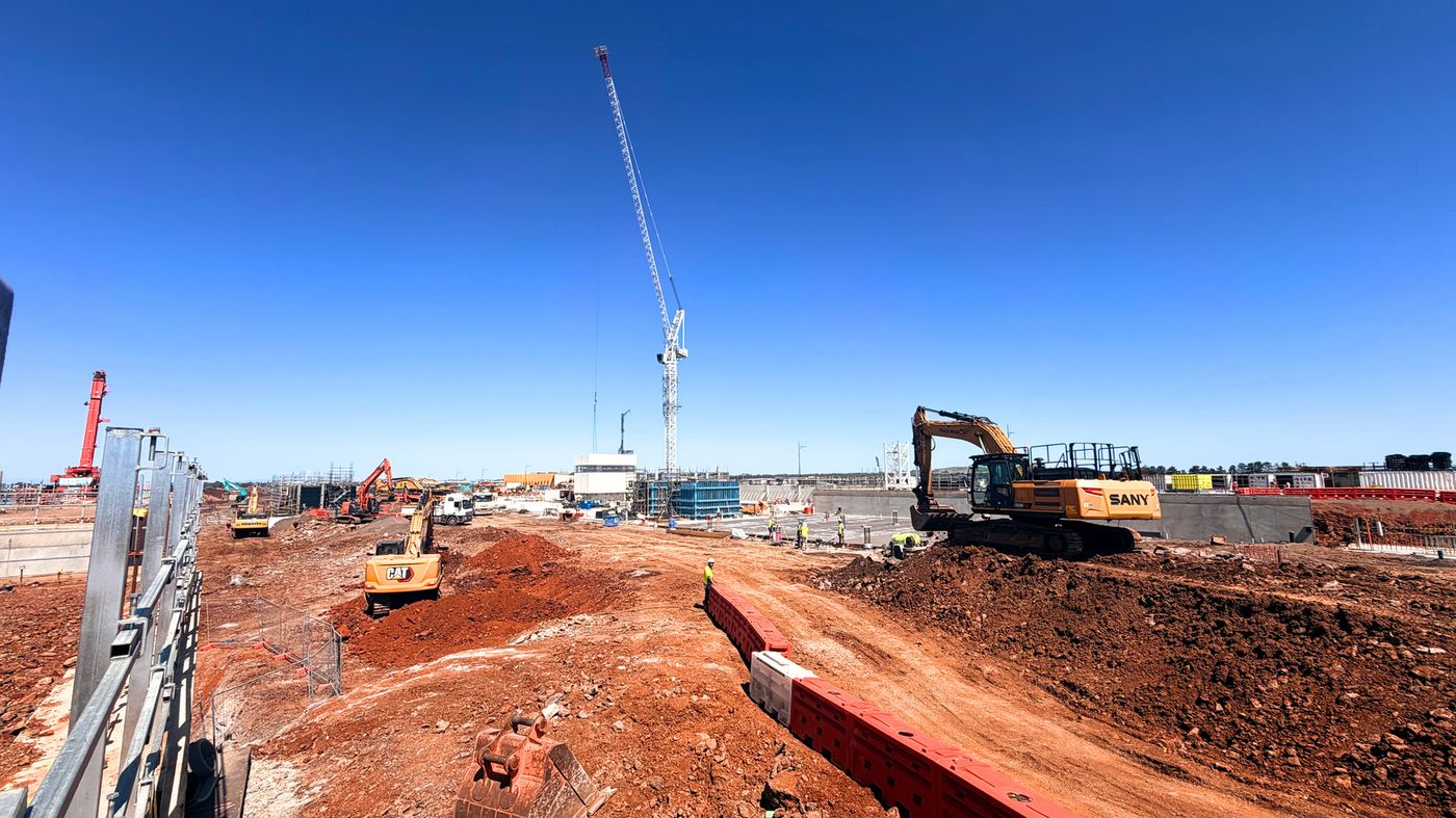 Excavator on red clay at the Melton Hospital site